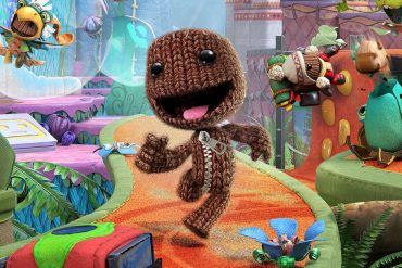 Sackboy running on a colorful path.
